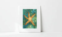 Matted artwork of a starfish on a teal and green abstract background