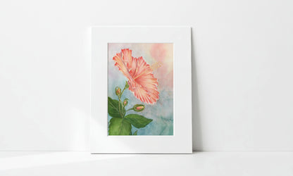 Matted artwork of a pink hibiscus flower with green leaves on a white background