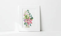 Matted floral artwork on a white surface with a white background
