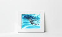 Matted artwork of mother and calf humpback whales underwater on a white background