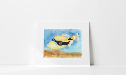 Matted print of Hawai'i state fish painting on a white surface